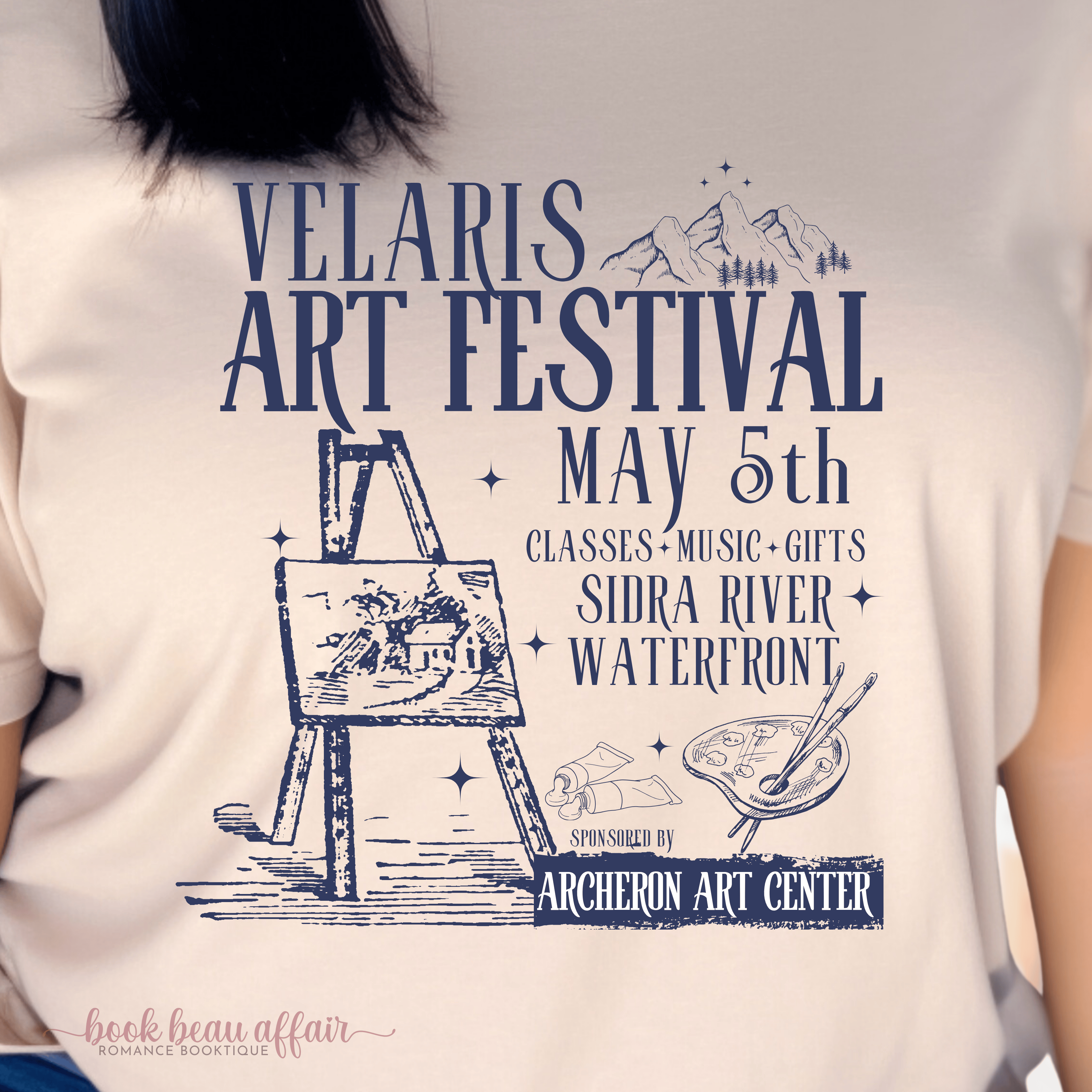 Tan tshirt that says Velaris Art Festival May 5th Sidra Riverfront