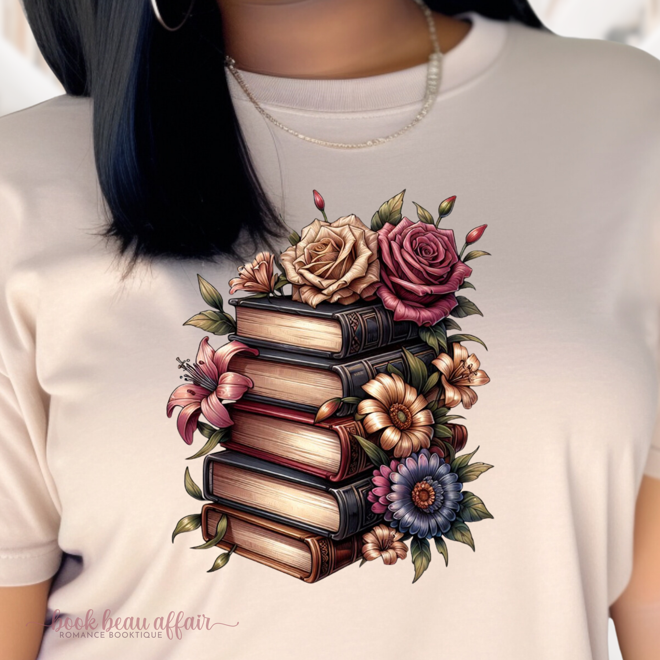 close up of Tshirt with a stack of books and flowers, floral bookish shirt, Sand Tan