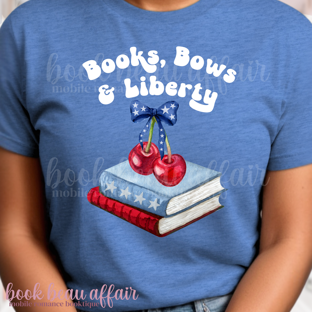 Blue t-shirt with 'Books, Bows & Liberty' design featuring books and cherries.