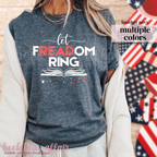 Heather navy sweatshirt with 'let FREEDOM RING' text, American flag in the background