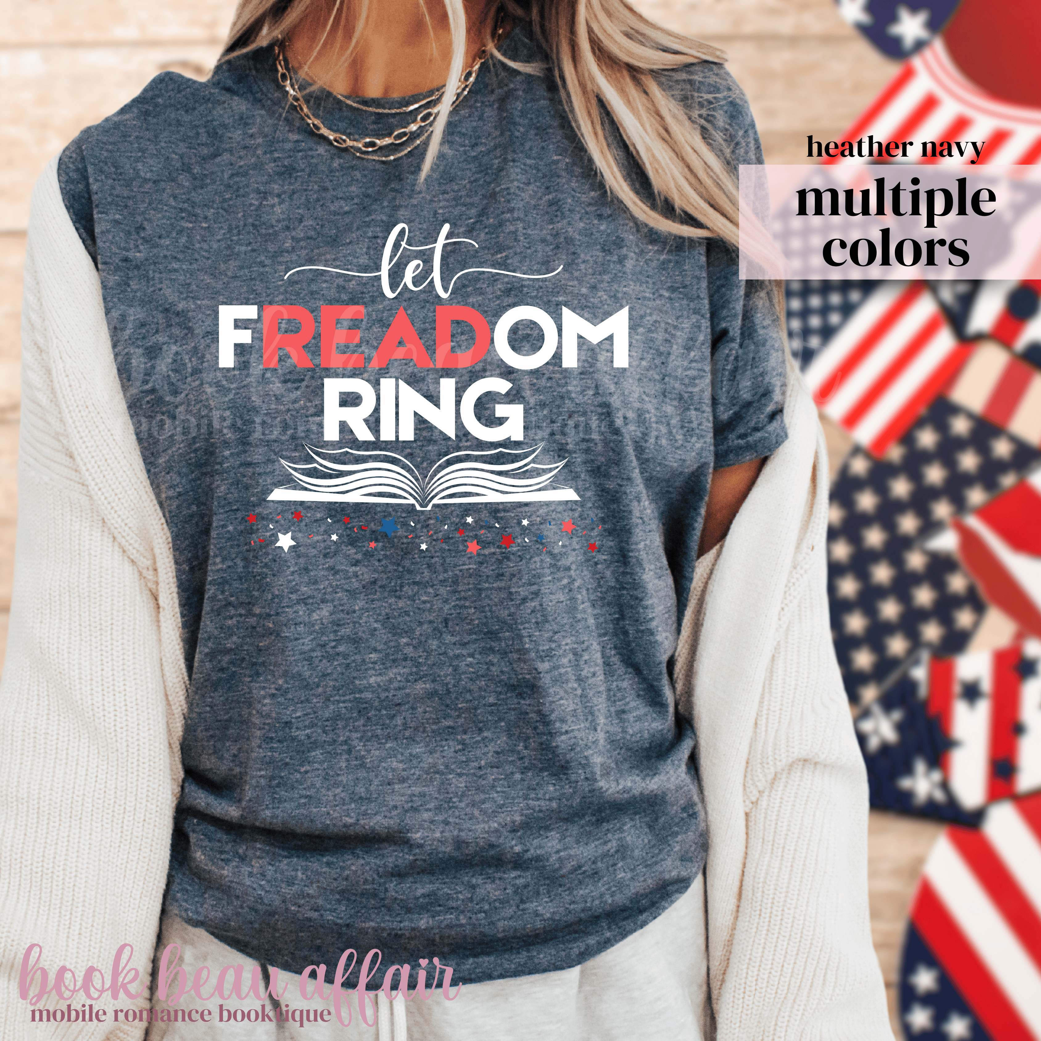 Heather navy sweatshirt with 'let FREEDOM RING' text, American flag in the background