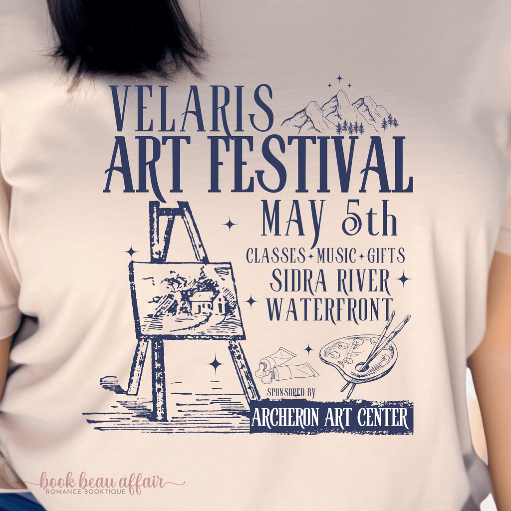 Tan tshirt that says Velaris Art Festival May 5th Sidra Riverfront