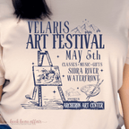 Tan tshirt that says Velaris Art Festival May 5th Sidra Riverfront