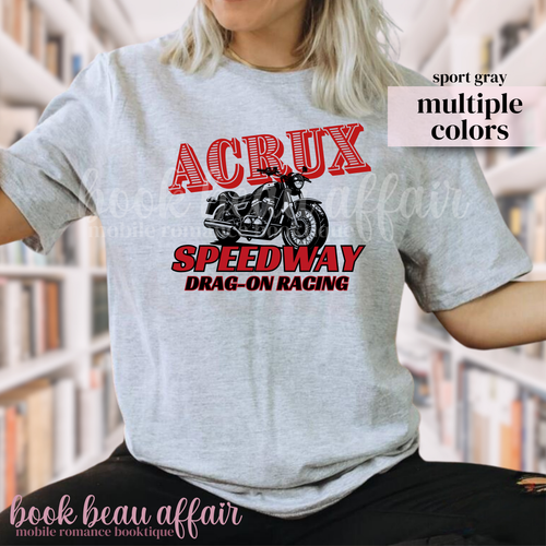 Person wearing a gray t-shirt with a motorcycle graphic and text, that says Acrux Speedway. Drag-on racing