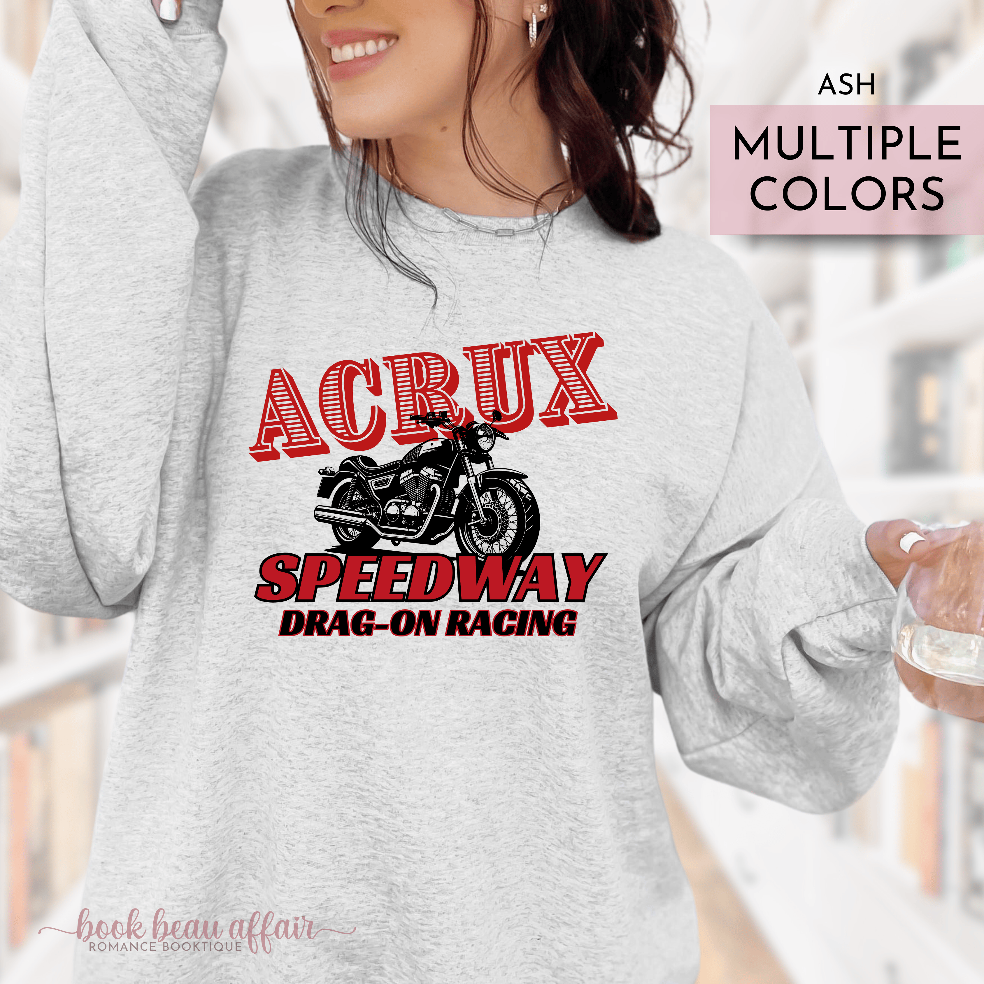 Person wearing a gray sweatshirt with 'ACRUX Speedway Drag-On Racing' design.