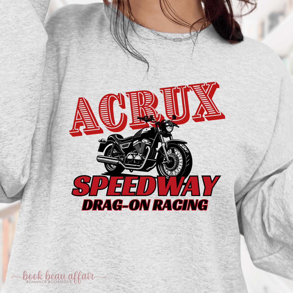 Gray sweatshirt with 'ACRUX Speedway Drag-On Racing' graphic on a blurred background