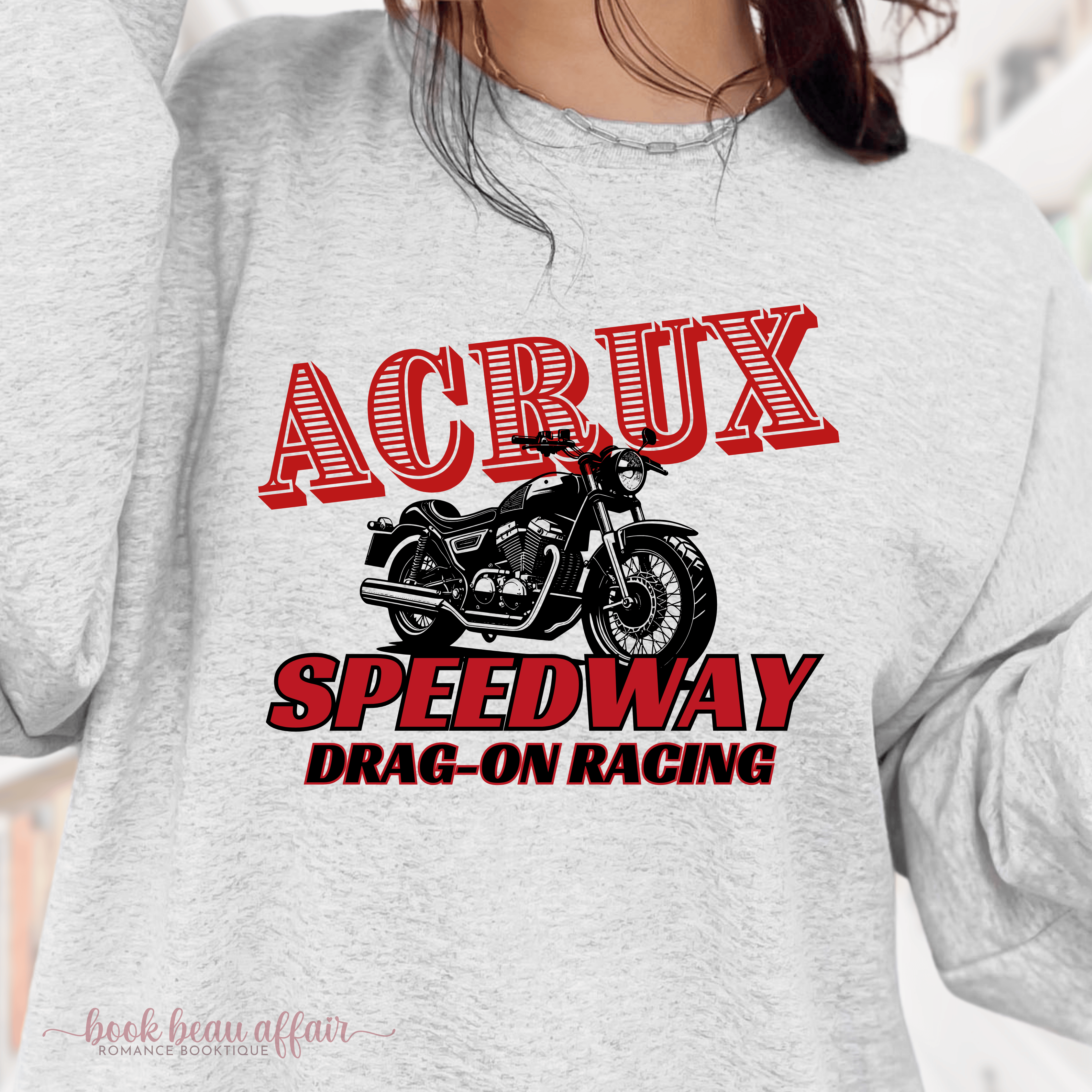 Gray sweatshirt with 'ACRUX Speedway Drag-On Racing' graphic on a blurred background