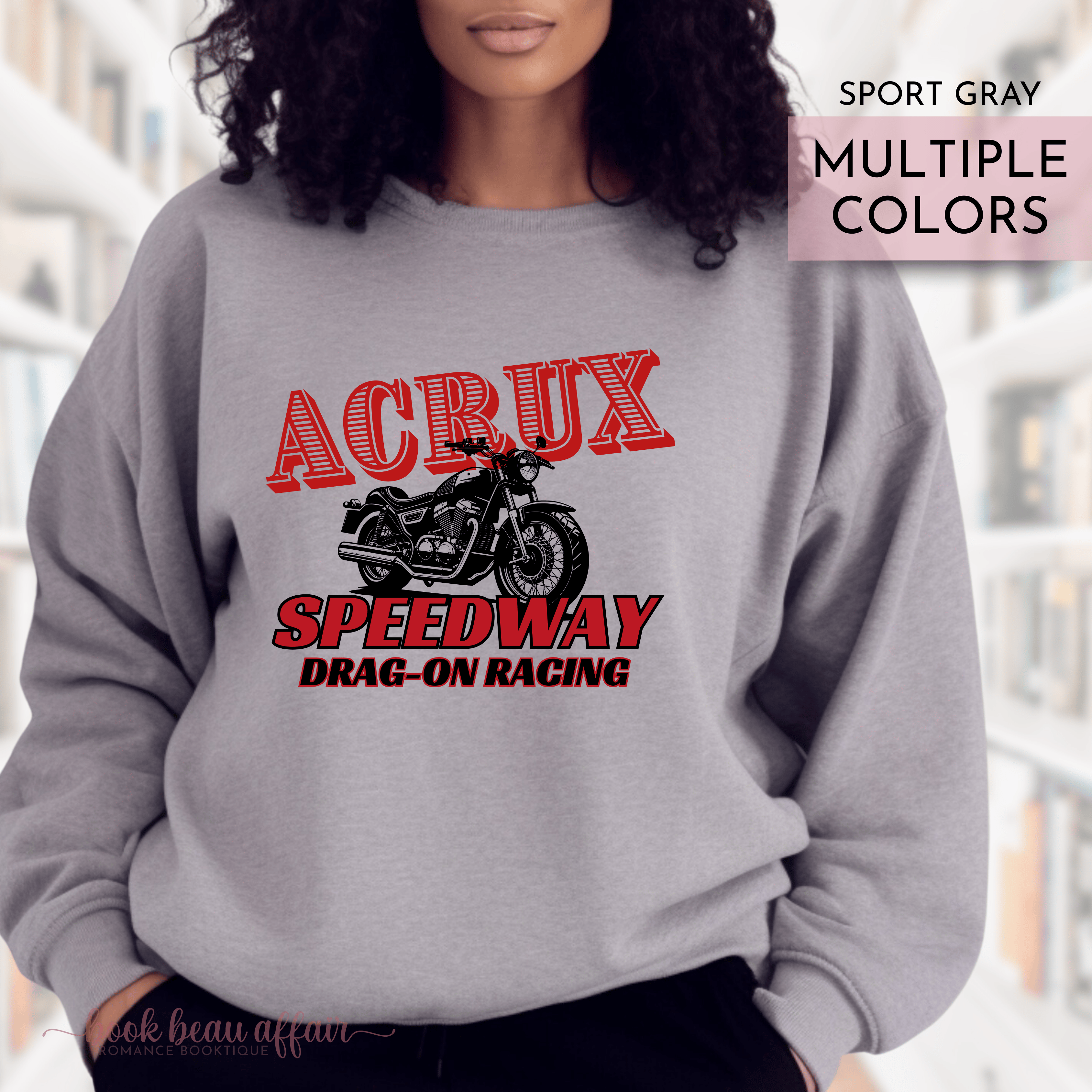 Person wearing a gray sweatshirt with 'ACRUX Speedway Drag-On Racing' text and graphic.