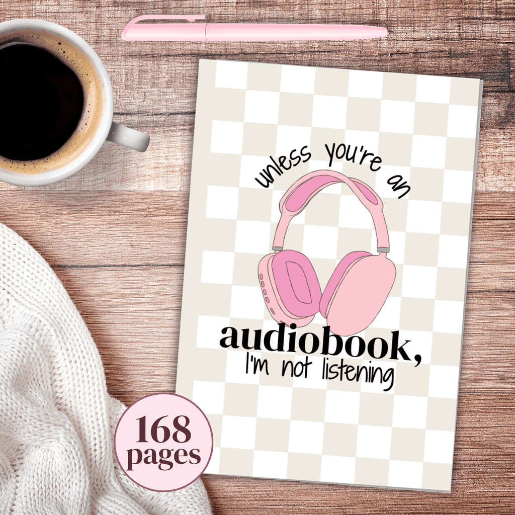 Notebook with pink headphones illustration and text on a checkered background, next to a cup of coffee and pen with text that says unless you're an audiobook, I'm not listening