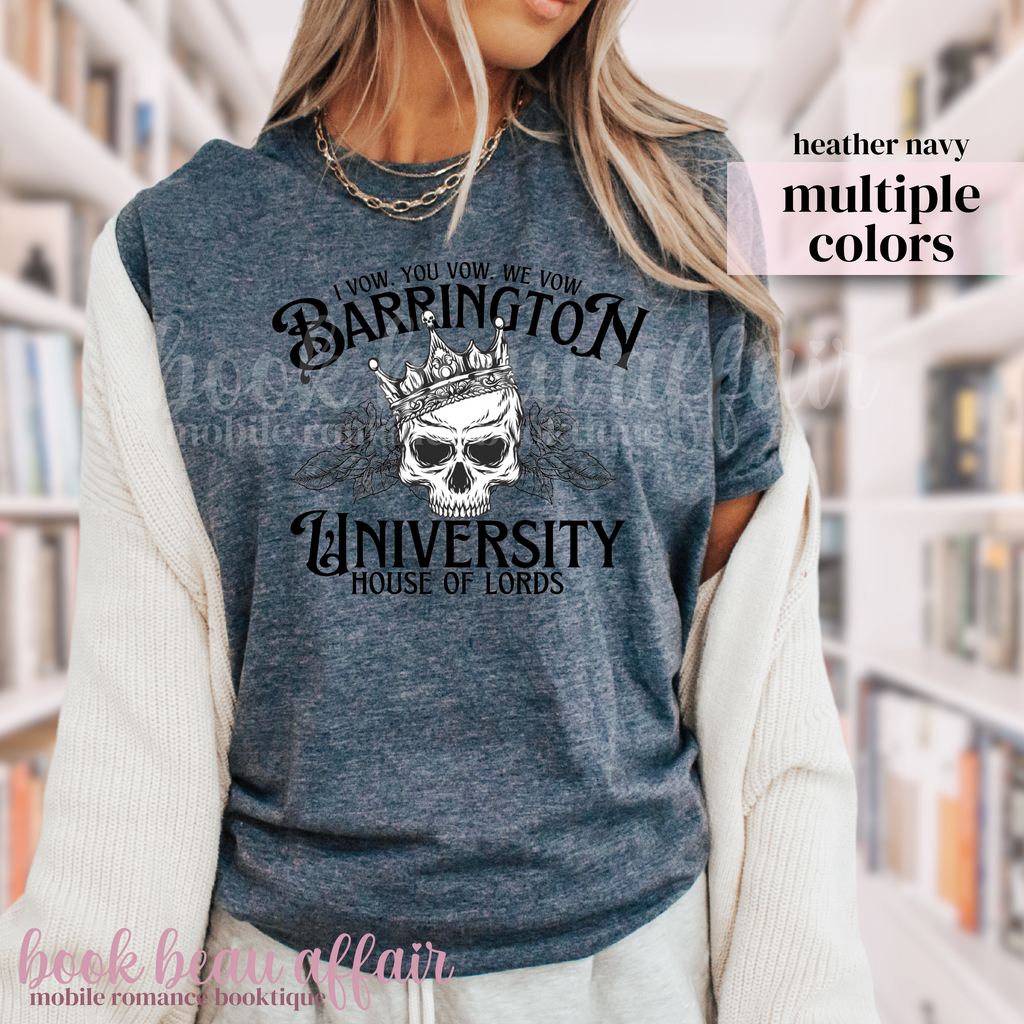 Person wearing a blue t-shirt with 'Barrington University House of Lords' design in a library setting.