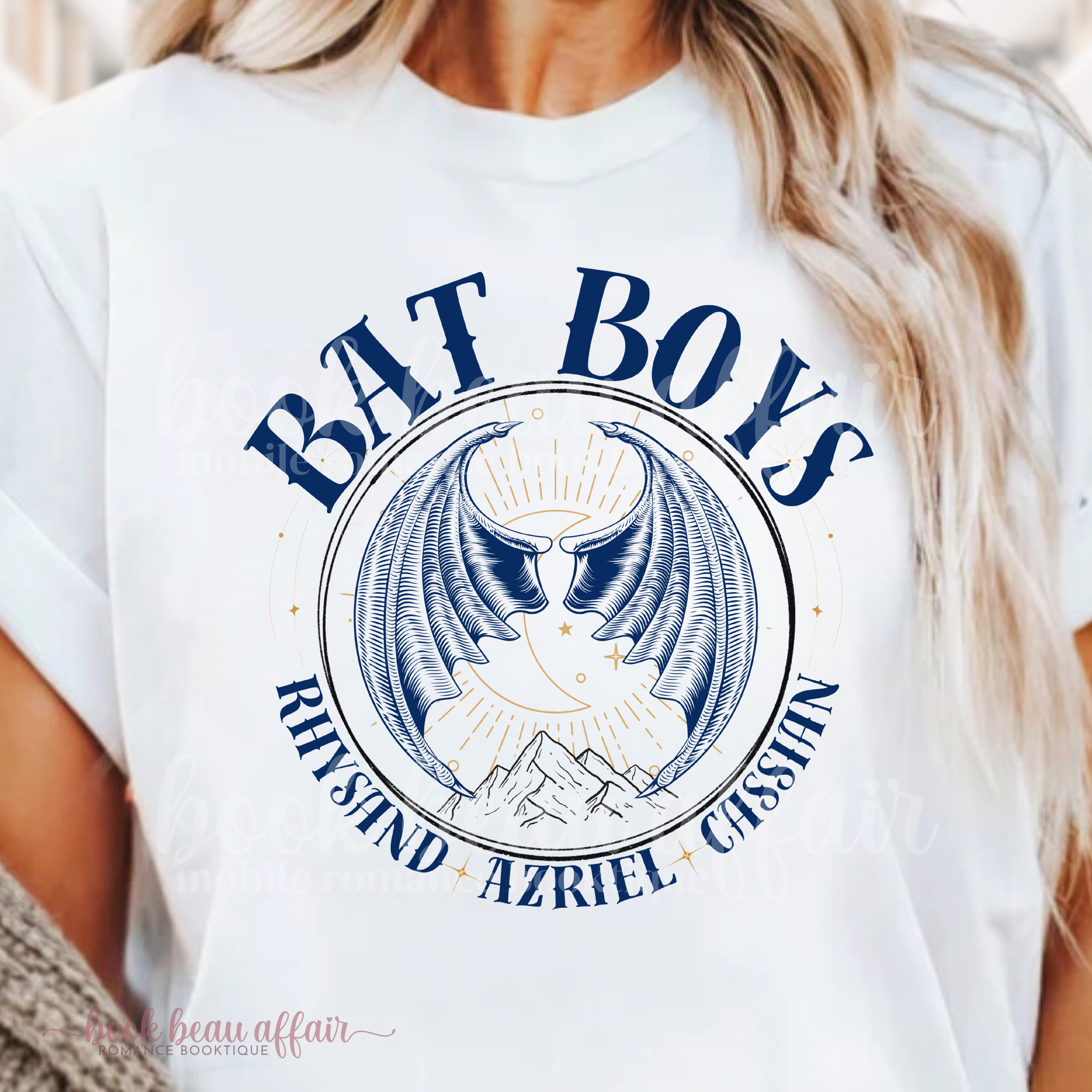 White t-shirt with 'BAT BOYS' graphic design featuring bat wings and a mountain side. With additional text that says Rhysand, Azriel, Cassian