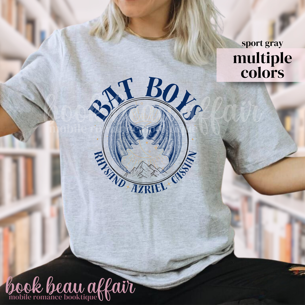 Gray T-Shirt with 'BAT BOYS' graphic design featuring bat wings and a mountain side. With additional text that says Rhysand, Azriel, Cassian