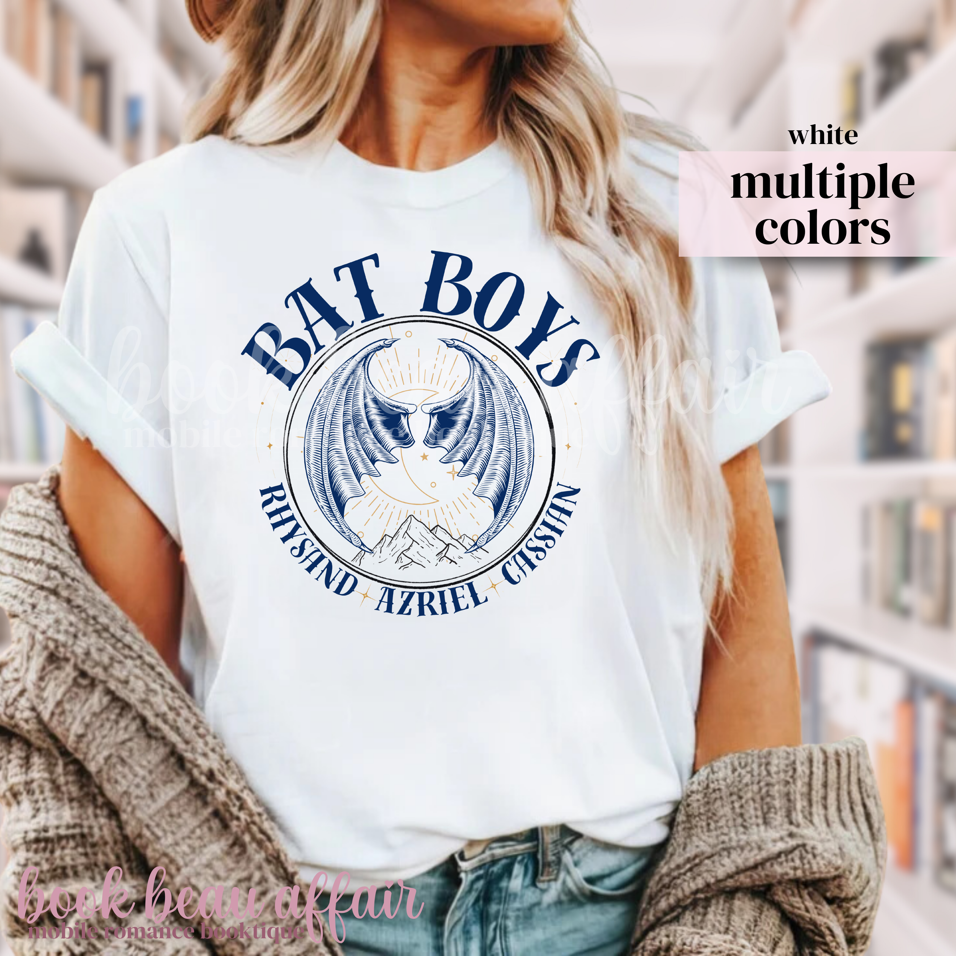 White t-shirt with 'BAT BOYS' graphic design featuring bat wings and a mountain side. With additional text that says Rhysand, Azriel, Cassian