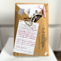 Blind Date with a Book. Mystery Book Wrapped in brown craft paper with a pen, stickers, bookmarks and other goodies