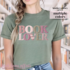 Green t-shirt with 'BOOK LOVER' text in a faux knitted font