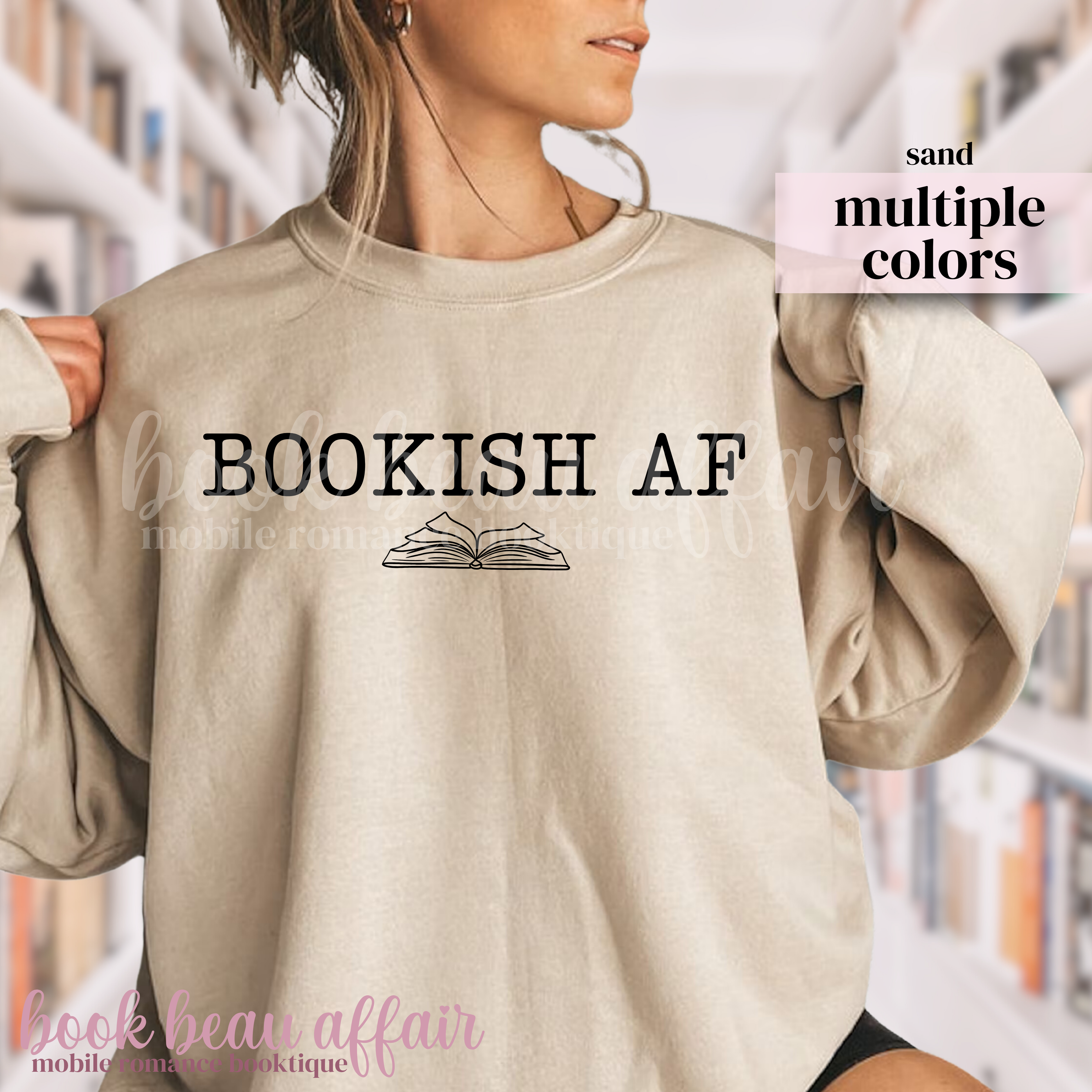 Beige sweatshirt with 'BOOKISH AF' text and book graphic worn by a person in a library setting.