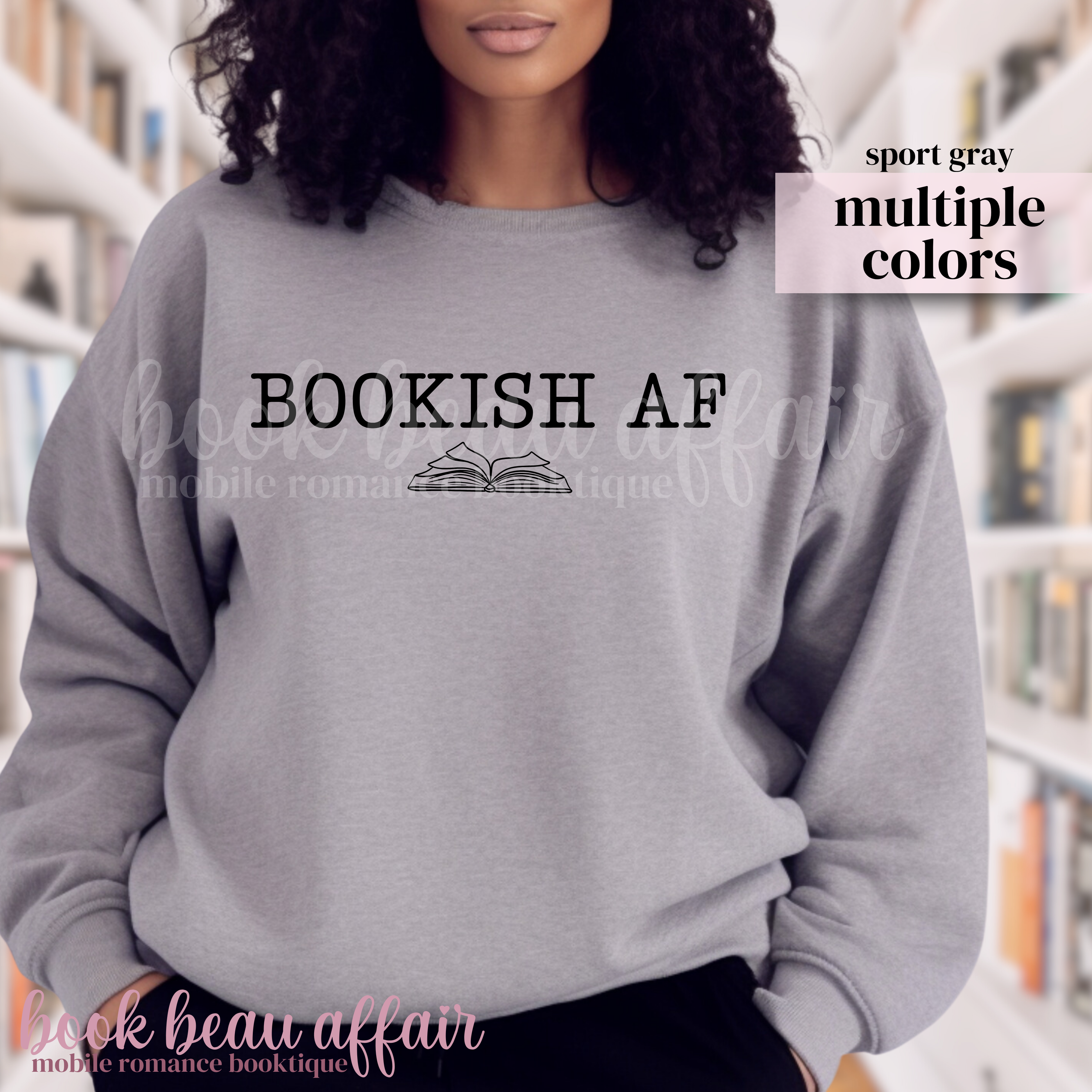 Person wearing a gray sweatshirt with 'BOOKISH AF' text in a library setting