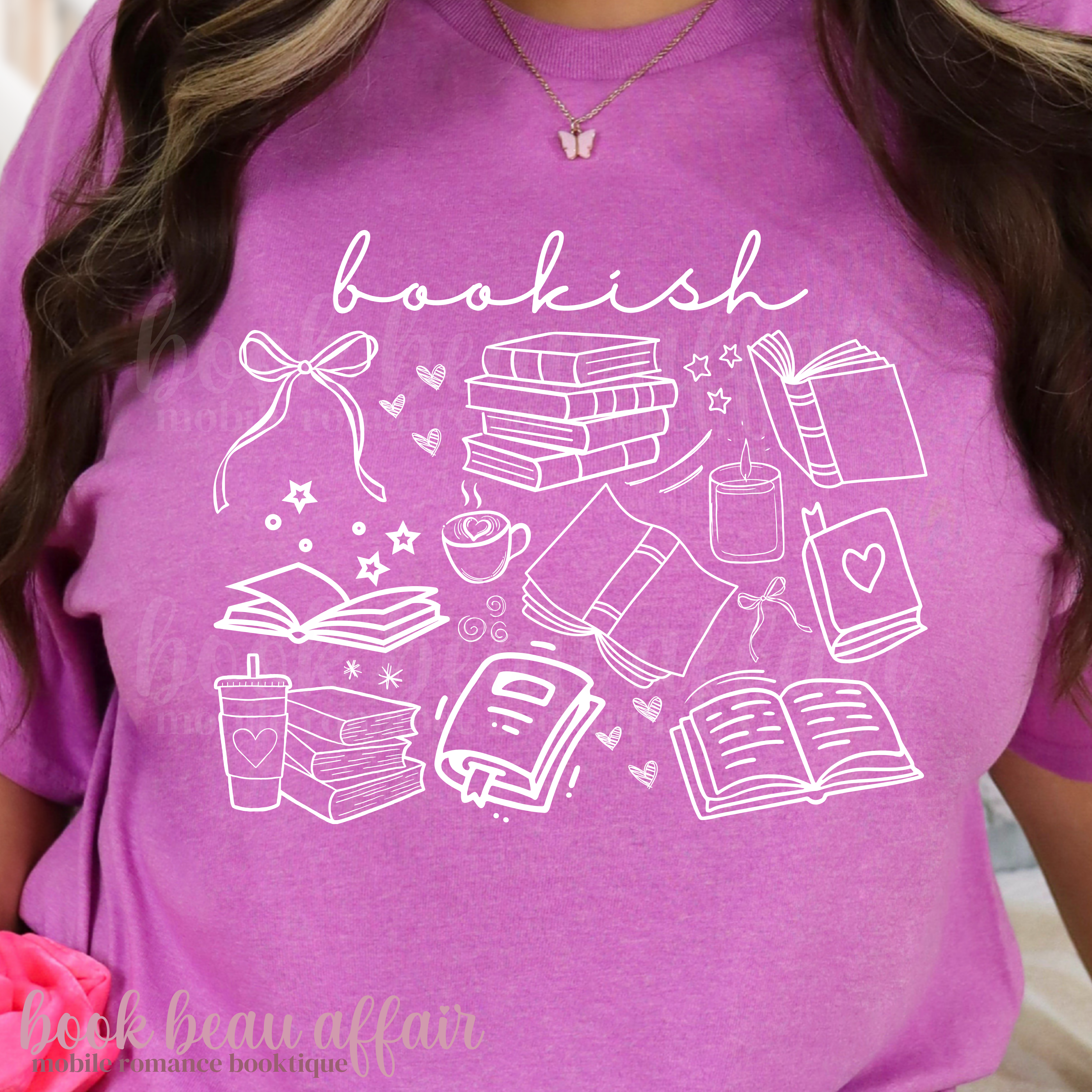 Purple t-shirt with white 'bookish' design featuring books and reading-related icons.