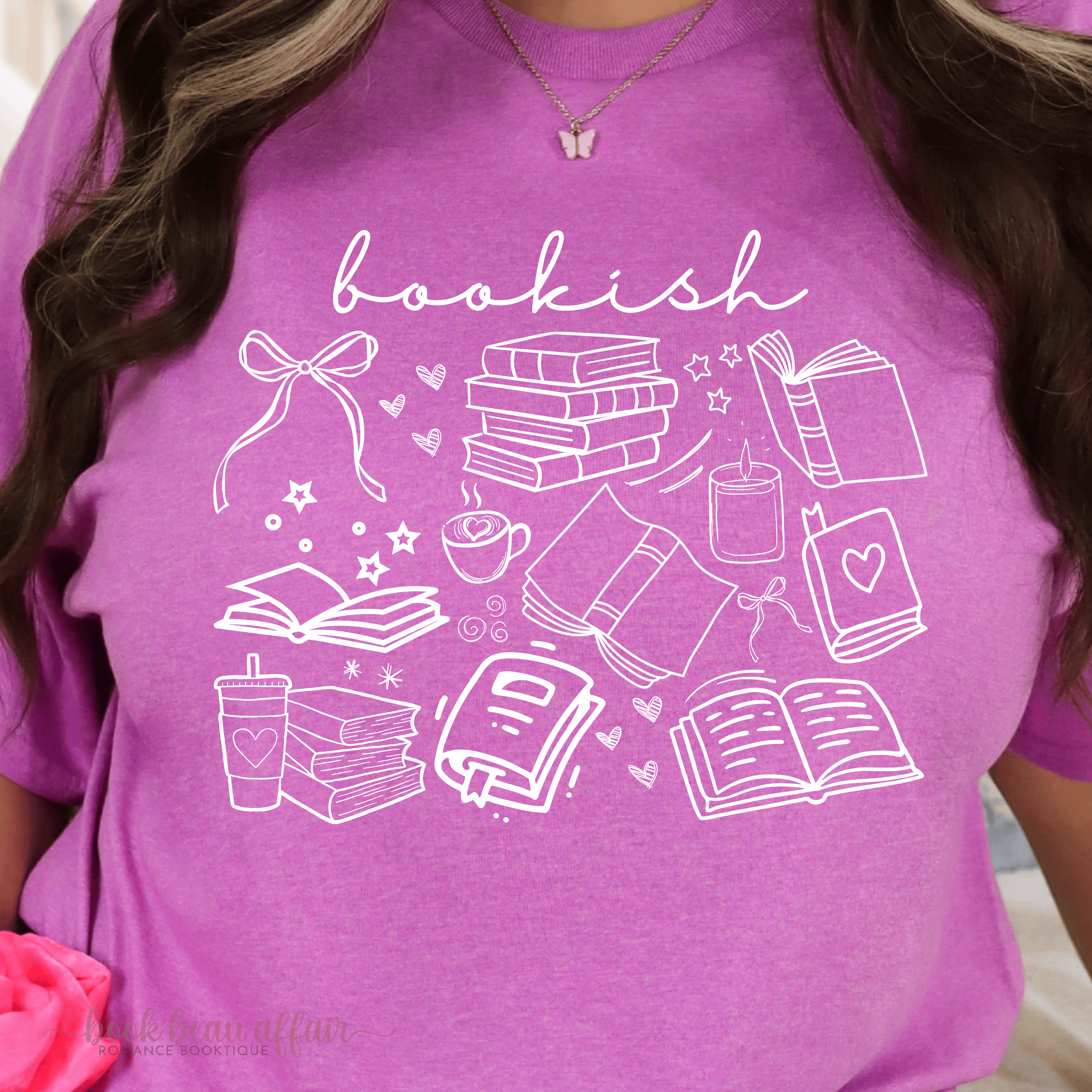 Close up of Bookish doodle t-shirt featuring hand-drawn book illustrations and "bookish" text on soft cotton tee.