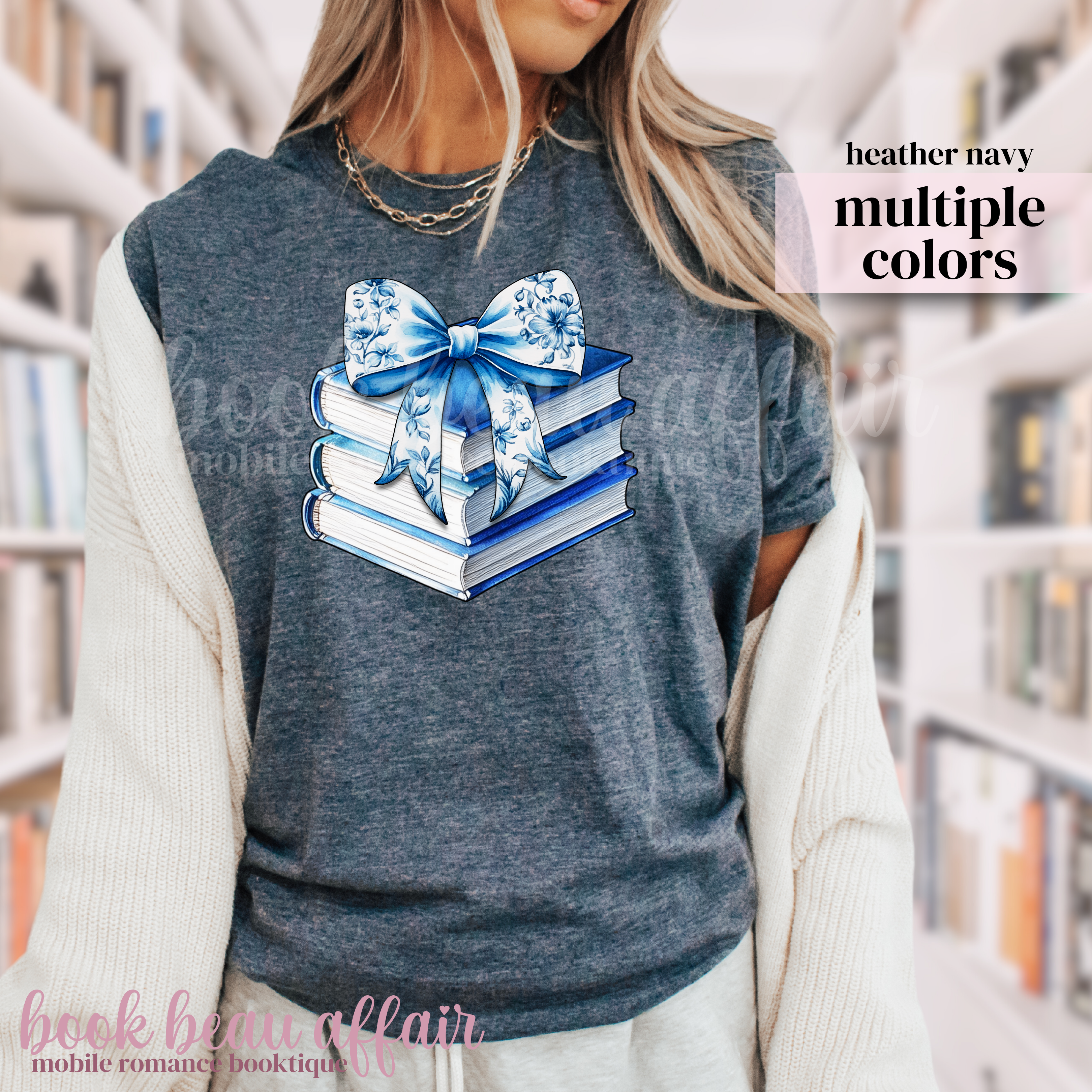 Stack of books with a blue floral bow on a navy t-shirt