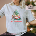 gray t-shirt with text All Booked For Christmas with a Christmas Tree Made out of books