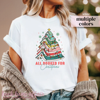 white t-shirt with text All Booked For Christmas with a Christmas Tree Made out of books