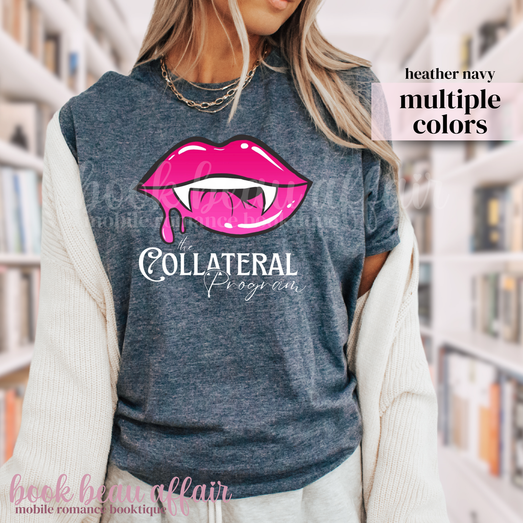 Person wearing a heather navy t-shirt with vampire teeth graphic and text that says the Collateral Program