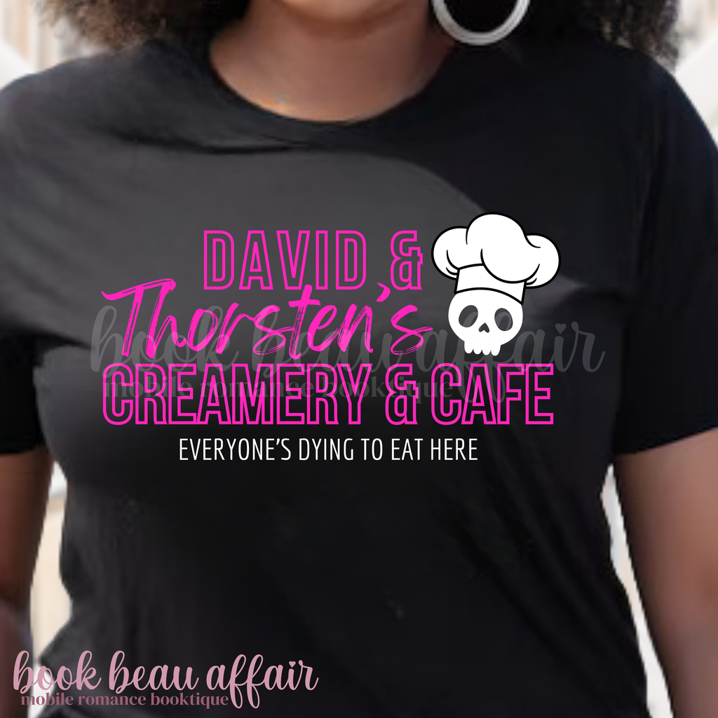 Front of a black t-shirt that says David and Thorsten's creamery and cafe. Everyone's dying to eat here