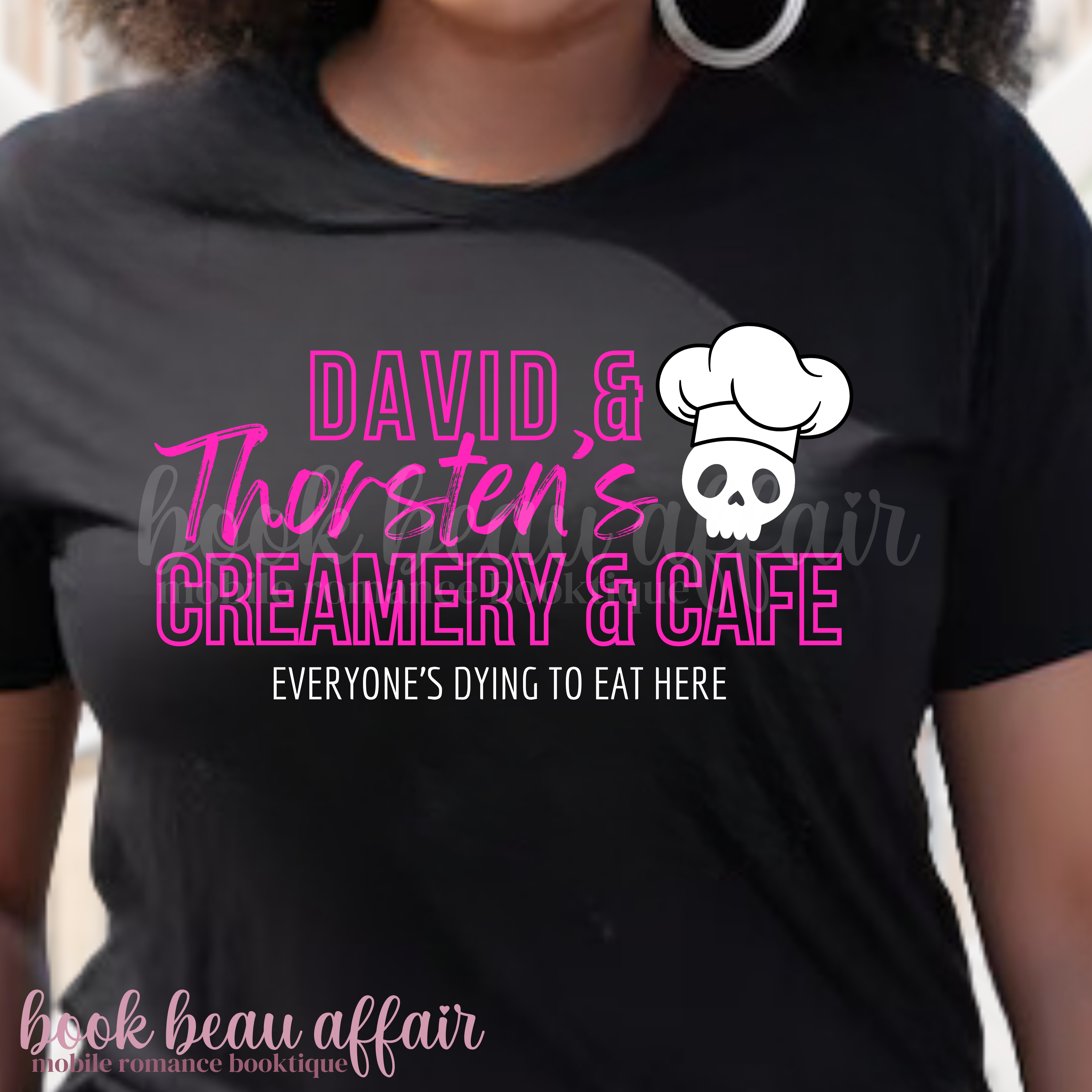 Front of a black t-shirt that says David and Thorsten's creamery and cafe. Everyone's dying to eat here