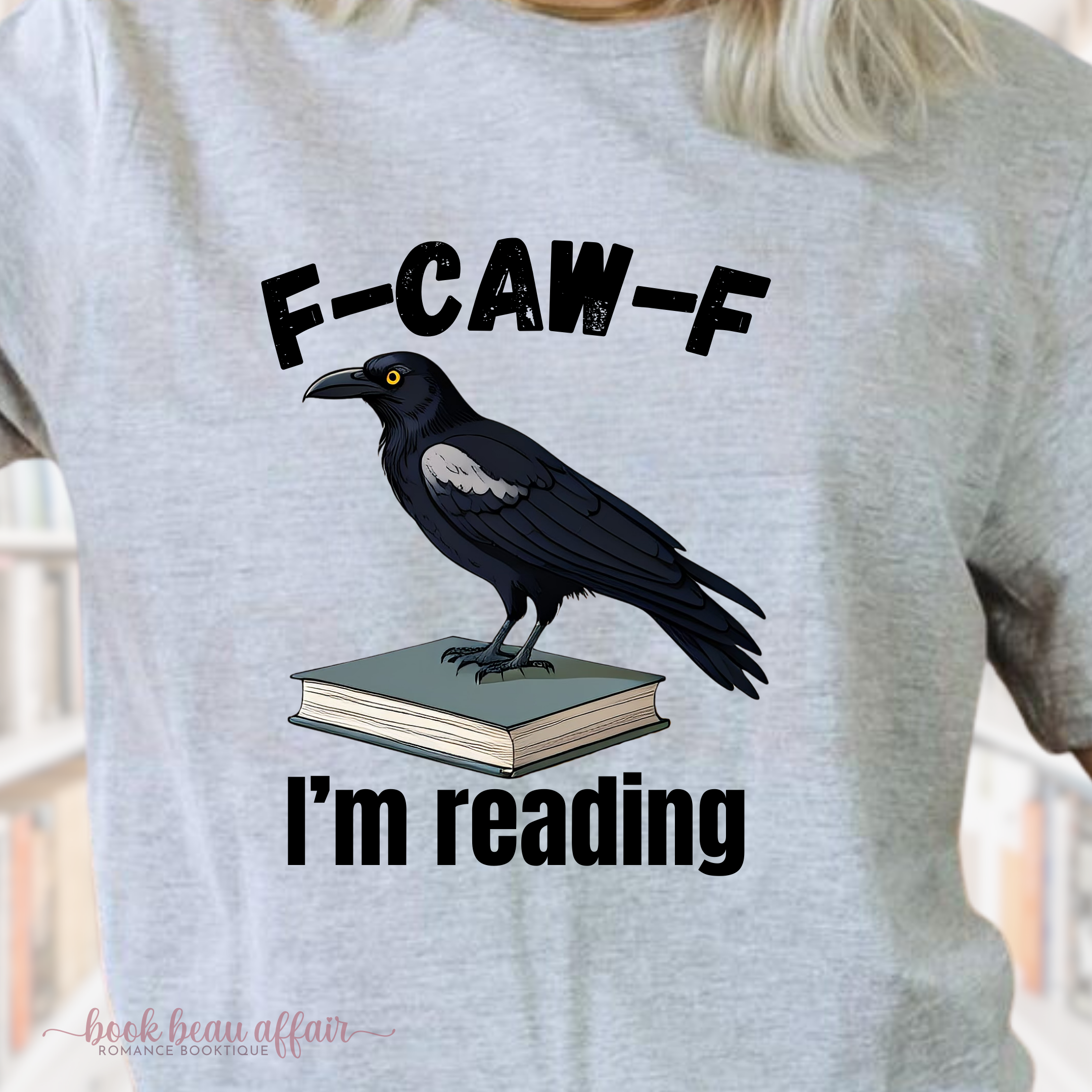 Close up of F-CAW-F I'm Reading, Fuck Off I'm Reading, Bookish shirt, Sport Gray, crow on books