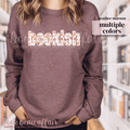 maroon sweatshirt with 'bookish' text featuring floral and pumpkin designs
