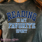 Gray t-shirt with 'Reading is my favorite sport' text in blue and white