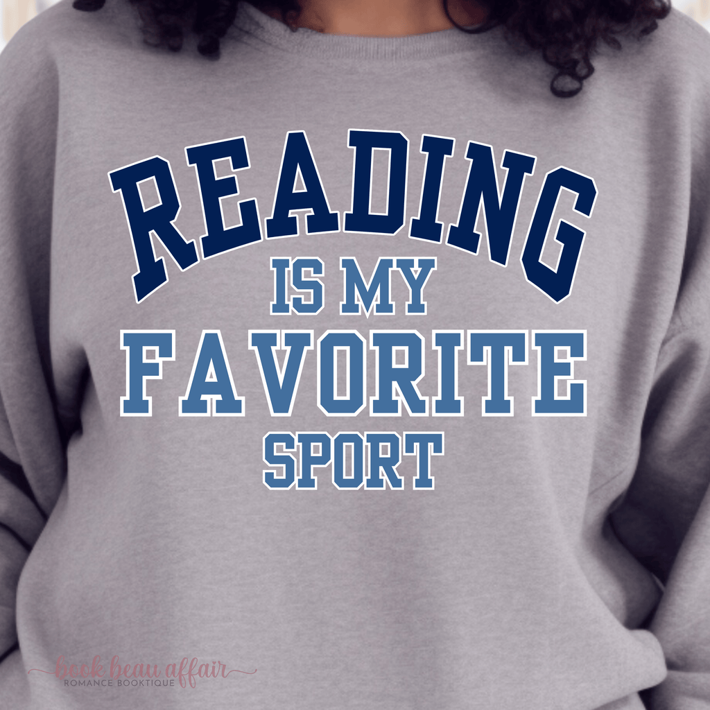 Gray sweatshirt with 'READING IS MY FAVORITE SPORT' text in blue and white