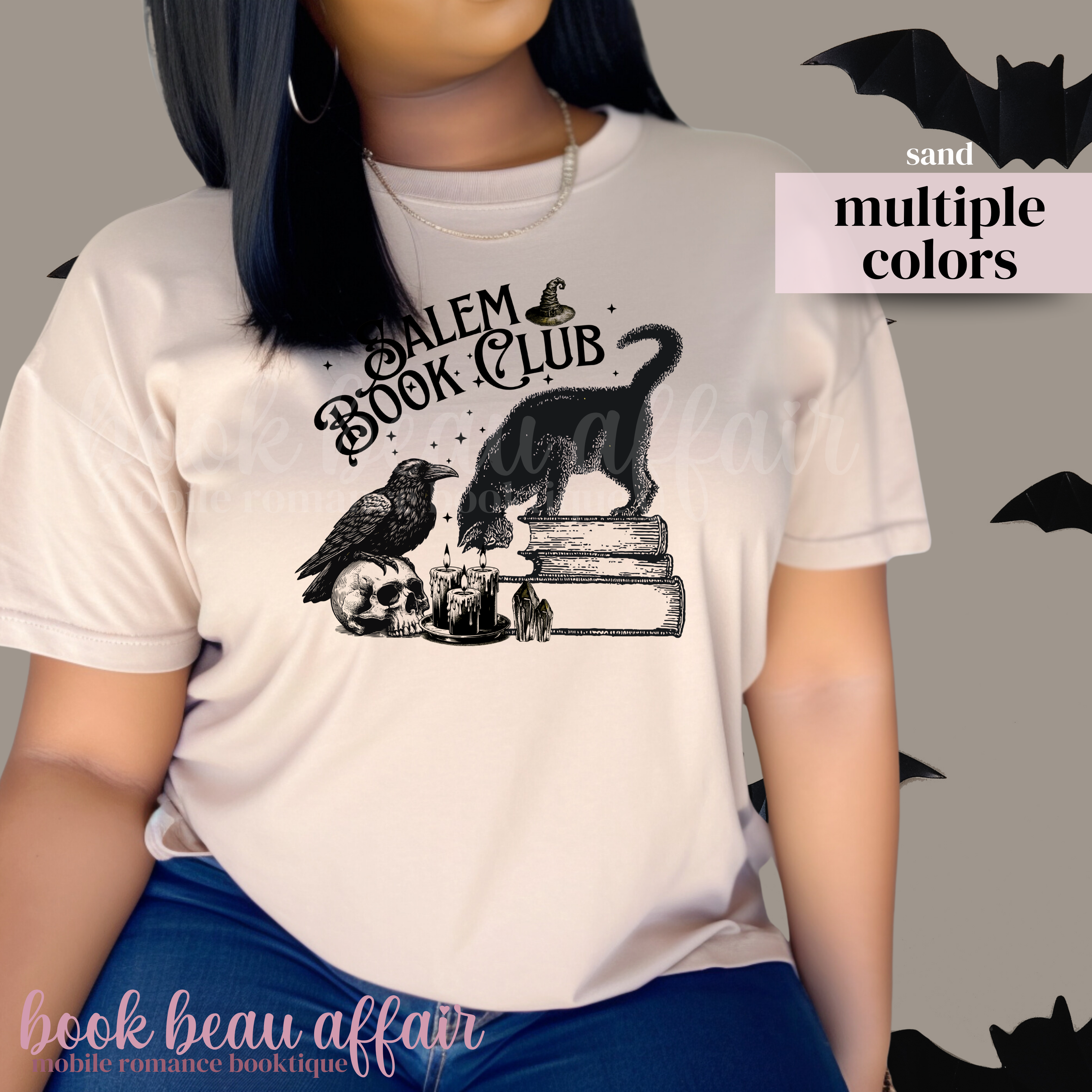 Beige t-shirt with 'Salem Book Club' design featuring a black cat, raven, and books.