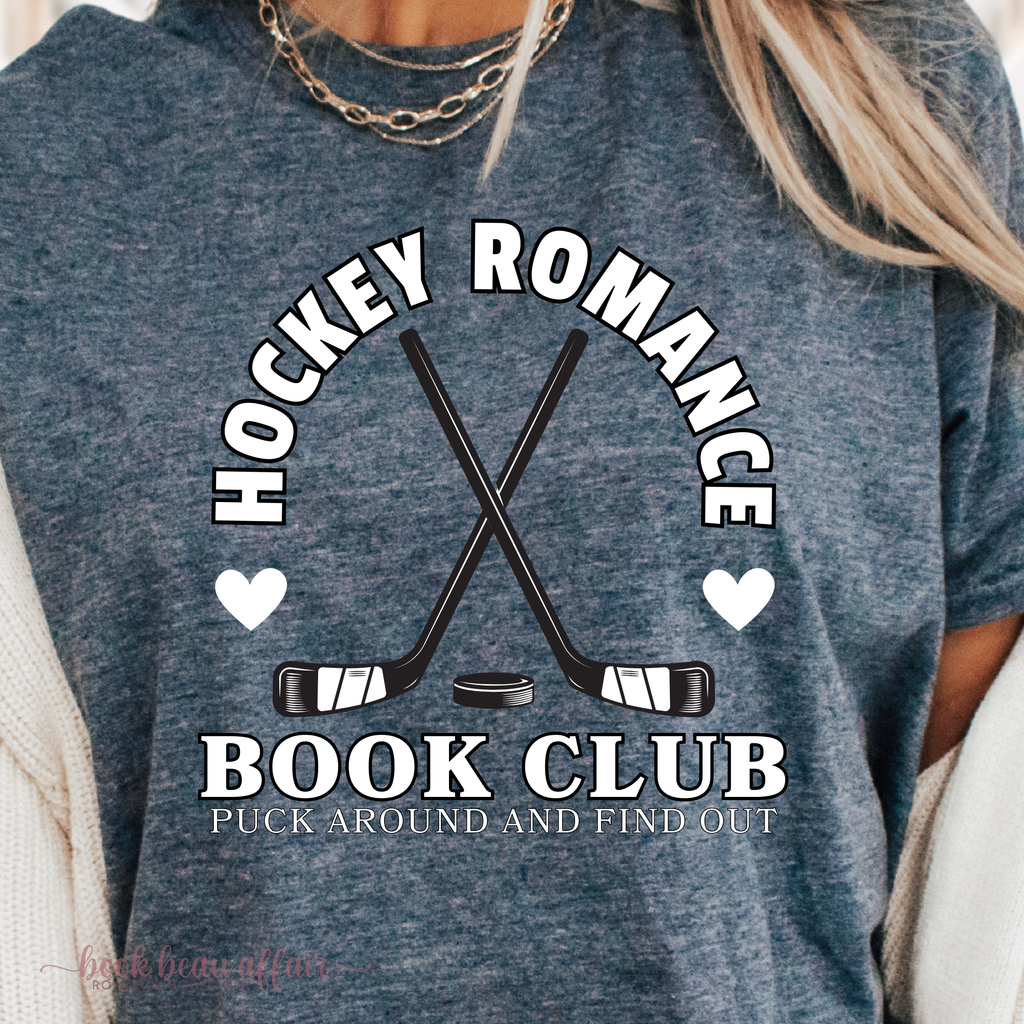 Close up of Hockey Romance Book Club graphic tee with 'Puck Around and Find Out' text. funny hockey romance tee for book lovers and sports romance fans. Heather Navy.