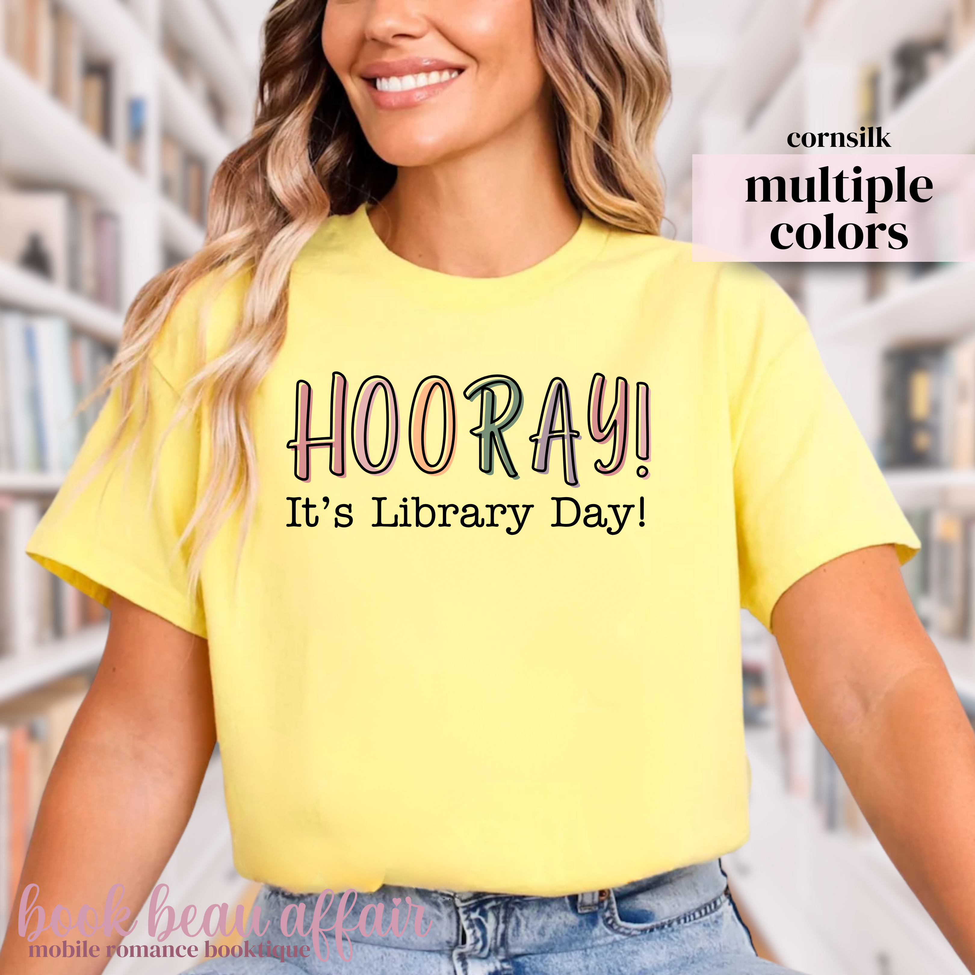 Yellow t-shirt with 'HOORAY! It's Library Day!' text worn by a person.