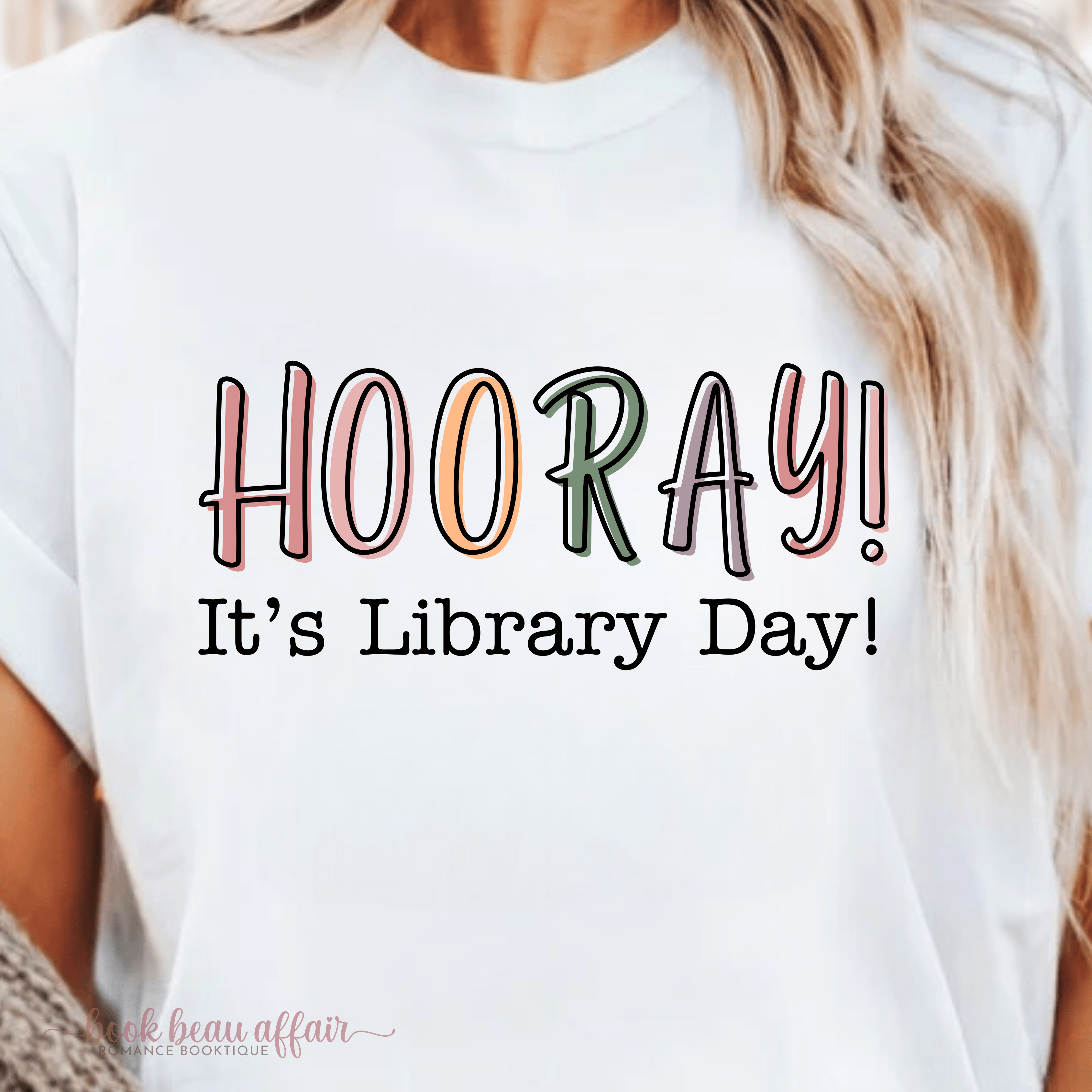 White tshirt that says Hooray It's Library Day