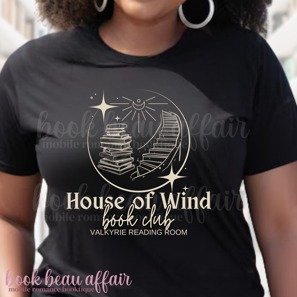 t-shirt with 'House of Wind book club' design in a library setting