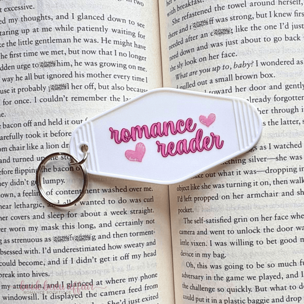 Book with a 'romance reader' marker on an open book