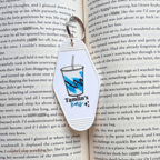 Keychain with a drink graphic and 'Tamlins Tears' text on an open book