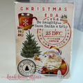 Kindle case insert  Christmas-themed with Santa Claus, tree, and text that says be naughty... save santa a trip