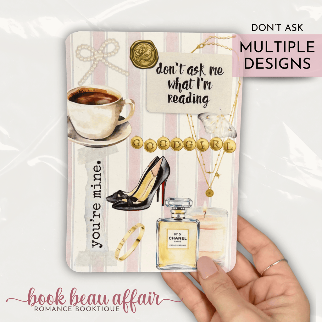Romance themed kindle case insert with text that says "don't ask me what I'm reading" and gold beads that spell out "good girl"