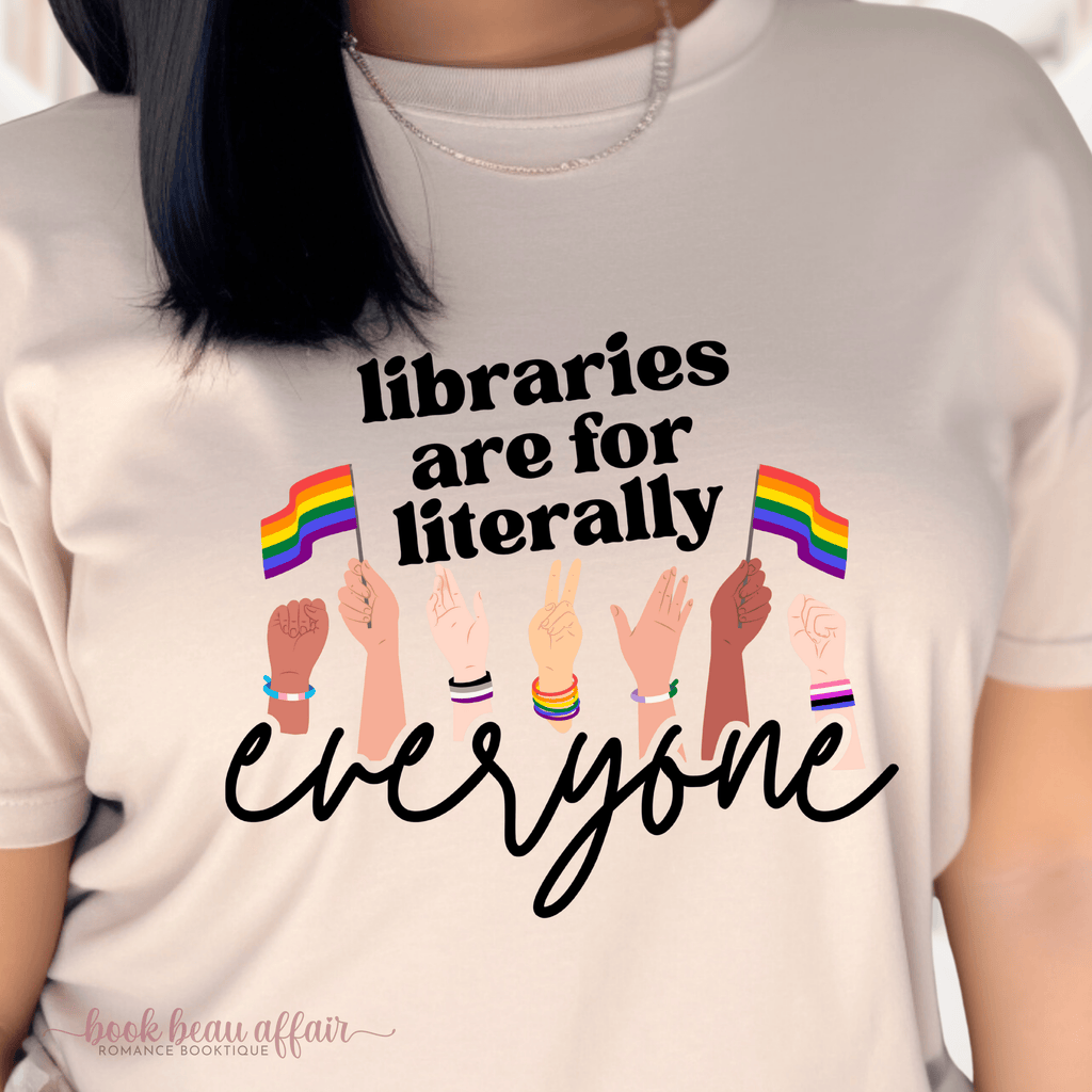 Close up of Libraries are for literally everyone. Pride Month Tee. Bookish Pride Month. LGBTQ+ Tee. Sand