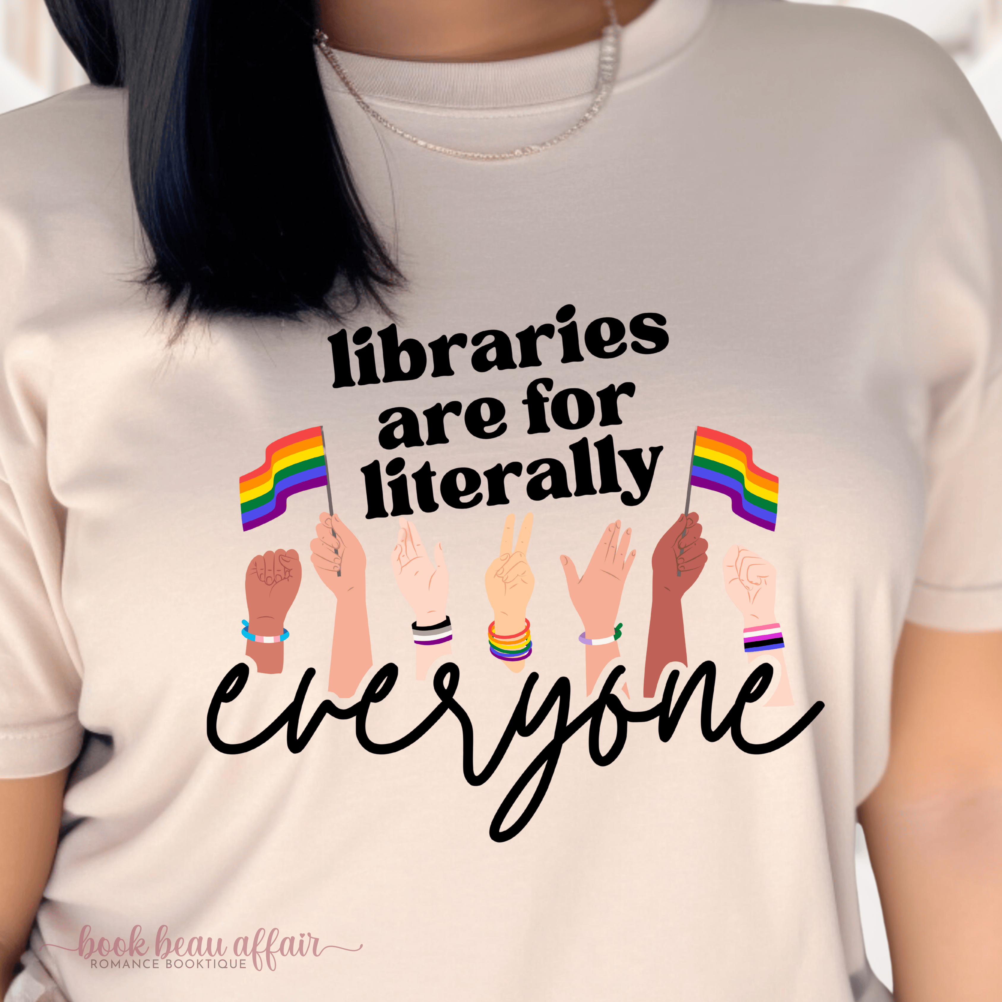 Close up of Libraries are for literally everyone. Pride Month Tee. Bookish Pride Month. LGBTQ+ Tee. Sand