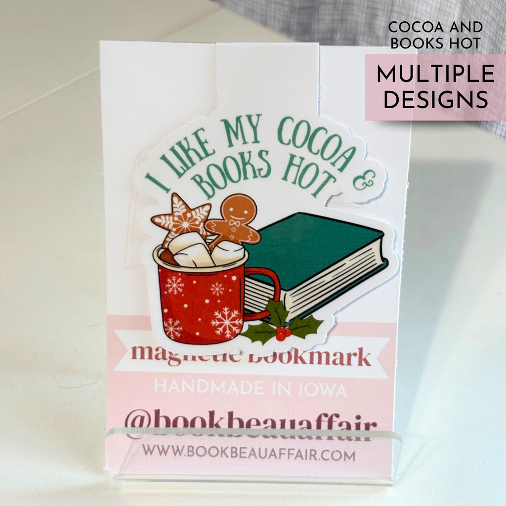Magnetic bookmark with 'I Like My Cocoa Books Hot' design on a stand.