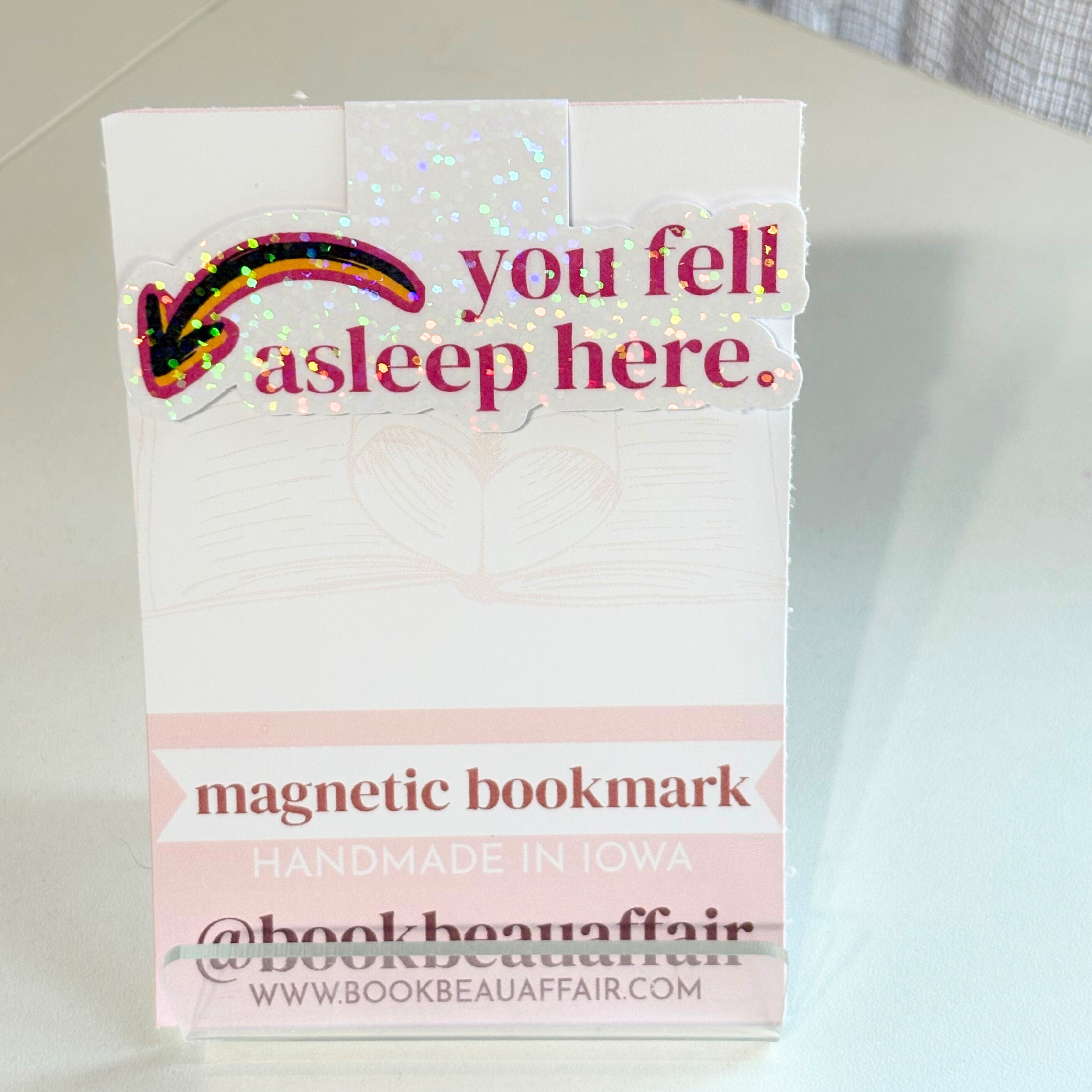Magnetic bookmark packaging with text you fell asleep here and an arrow
