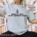 T-shirt with text 'Morally Gray is my favorite color' and a skeleton hand peace sign.