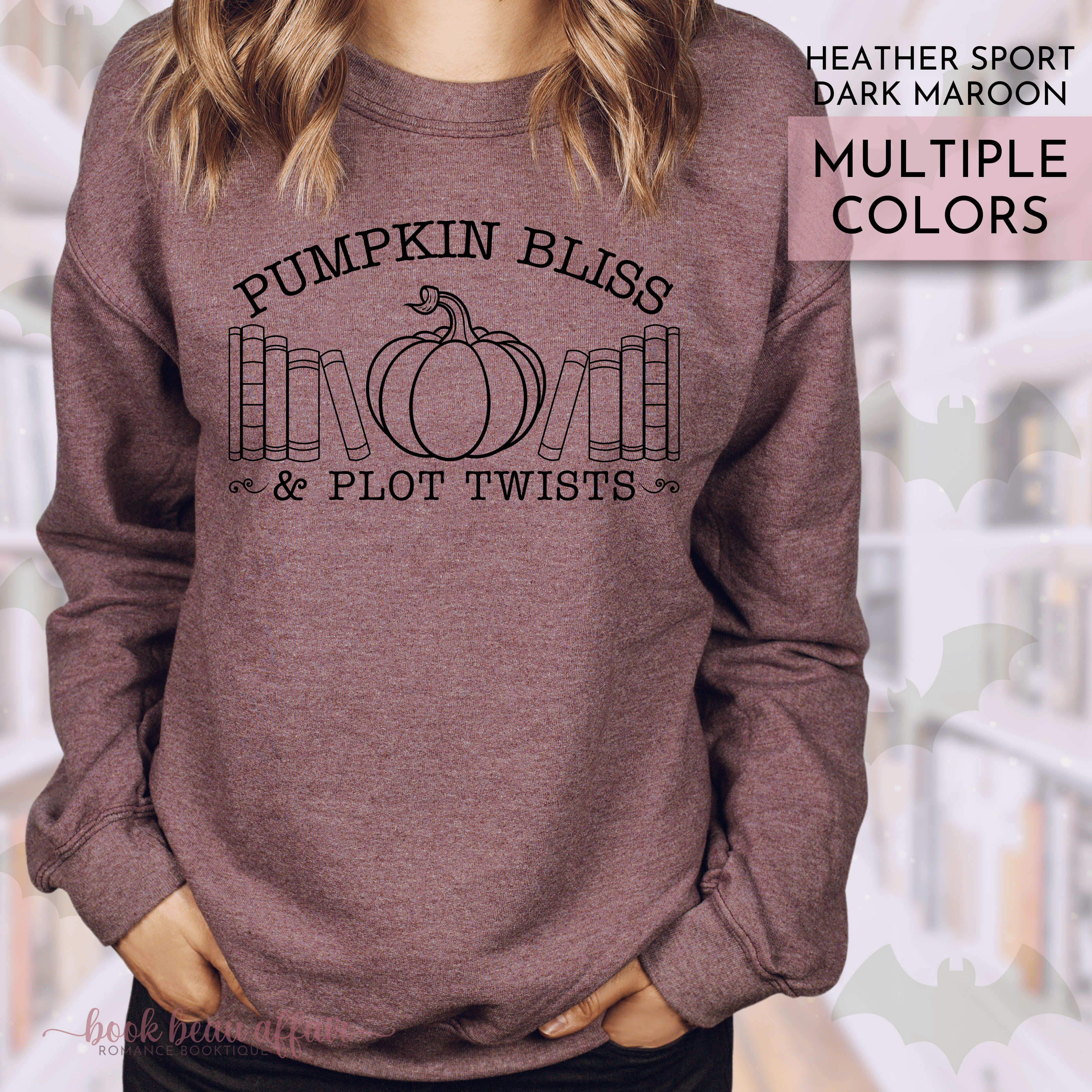 Heather dark maroon sweatshirt with 'Pumpkin Bliss & Plot Twists' text and pumpkin graphic.