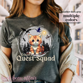 t-shirt with dragons and an orange tabby cat that says "Broccoli's Quest Squad"
