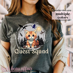t-shirt with dragons and an orange tabby cat that says "Broccoli's Quest Squad"